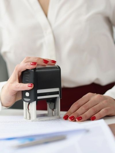 Jennifer Garland stamping a document